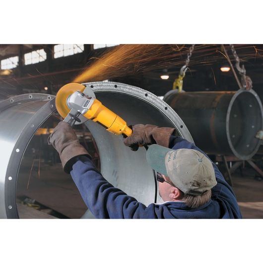7 inch / 180 millimeter Medium Angle Grinder being used on giant metal structure.
